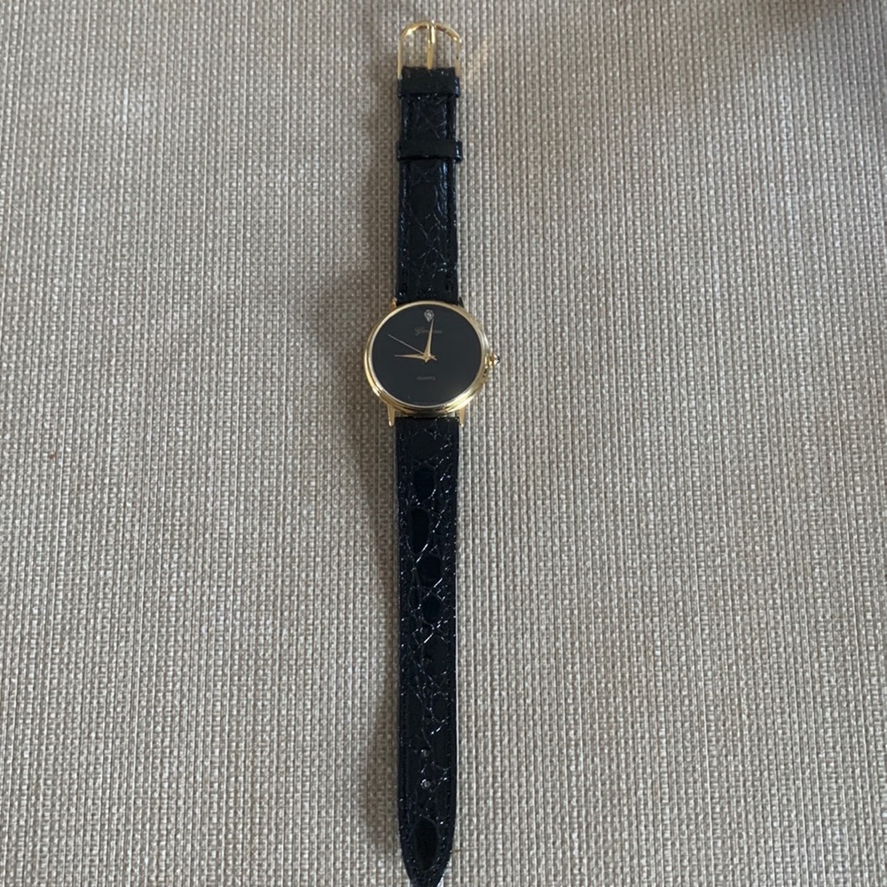 Never worn Vintage Geneva watch black leather strap 1-1/4” face